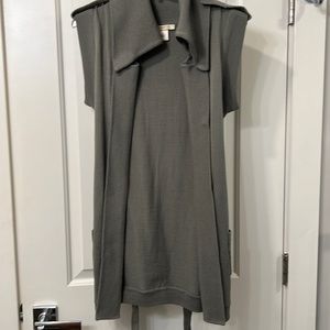 Sweater vest with snap details, pockets blouse-like back